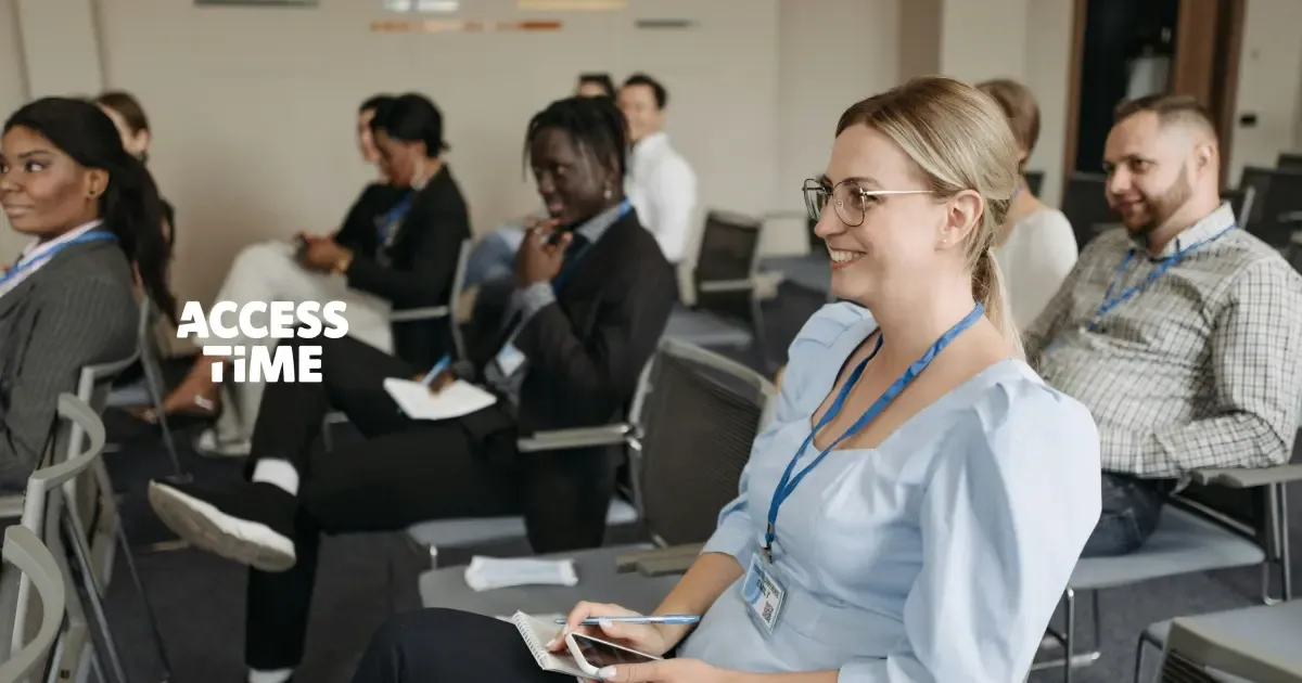A casual corporate event, the attendees are smiling